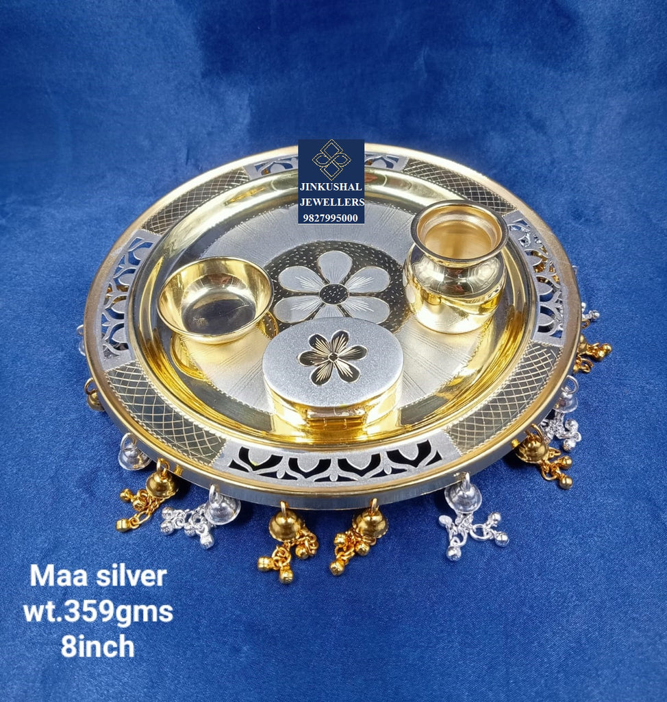 silver thali with gold polish