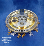 silver thali with gold polish