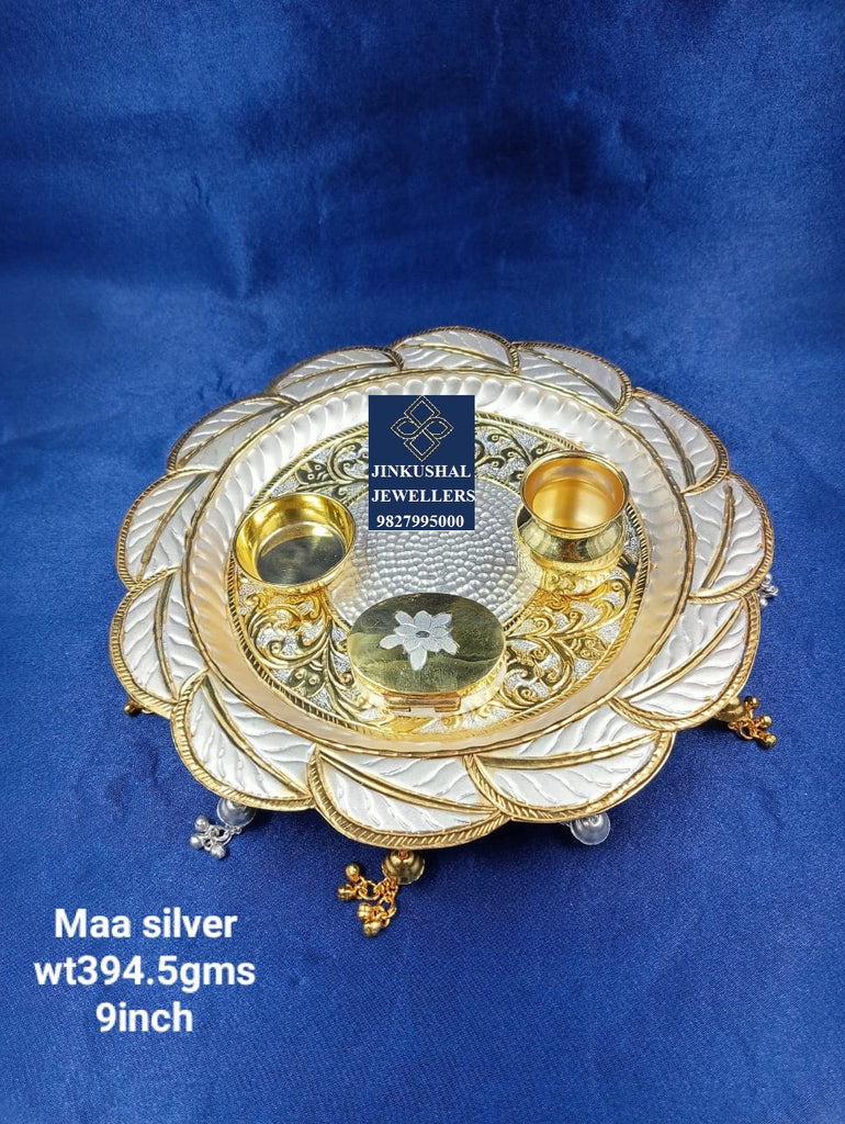 silver thali with gold polish