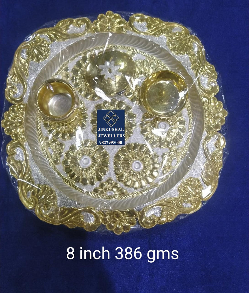 silver thali with gold polish