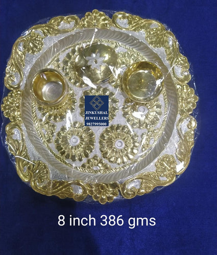 silver thali with gold polish