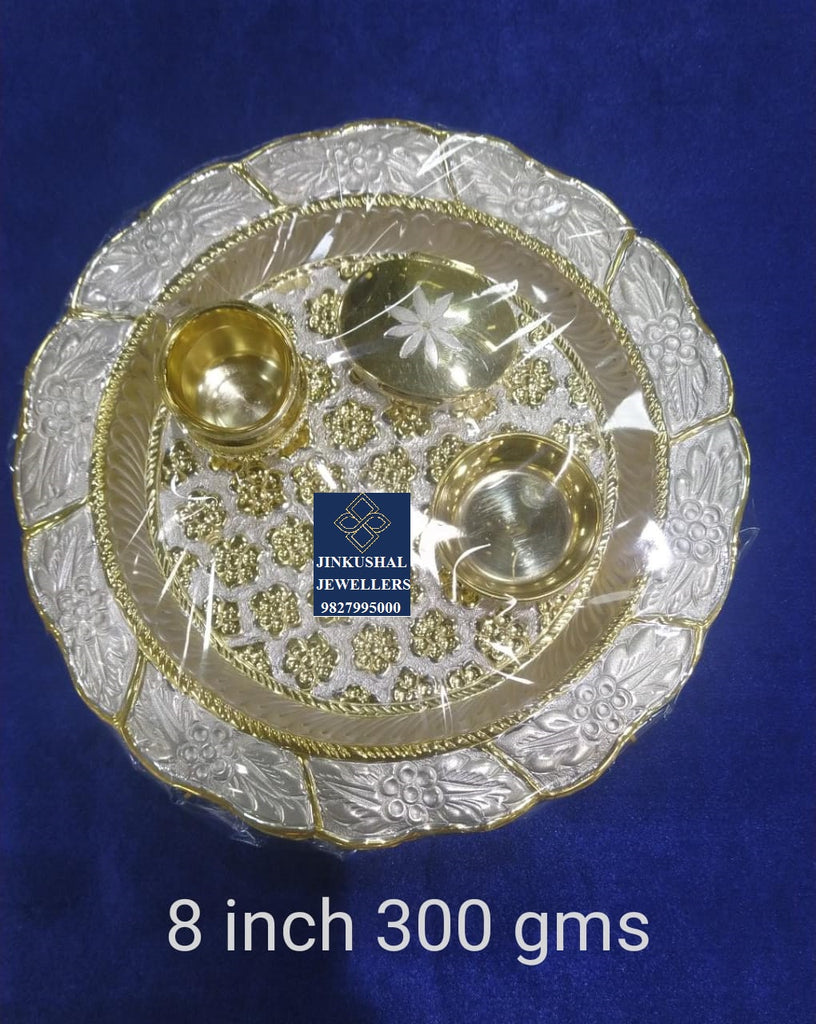 silver thali with gold polish