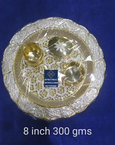 silver thali with gold polish