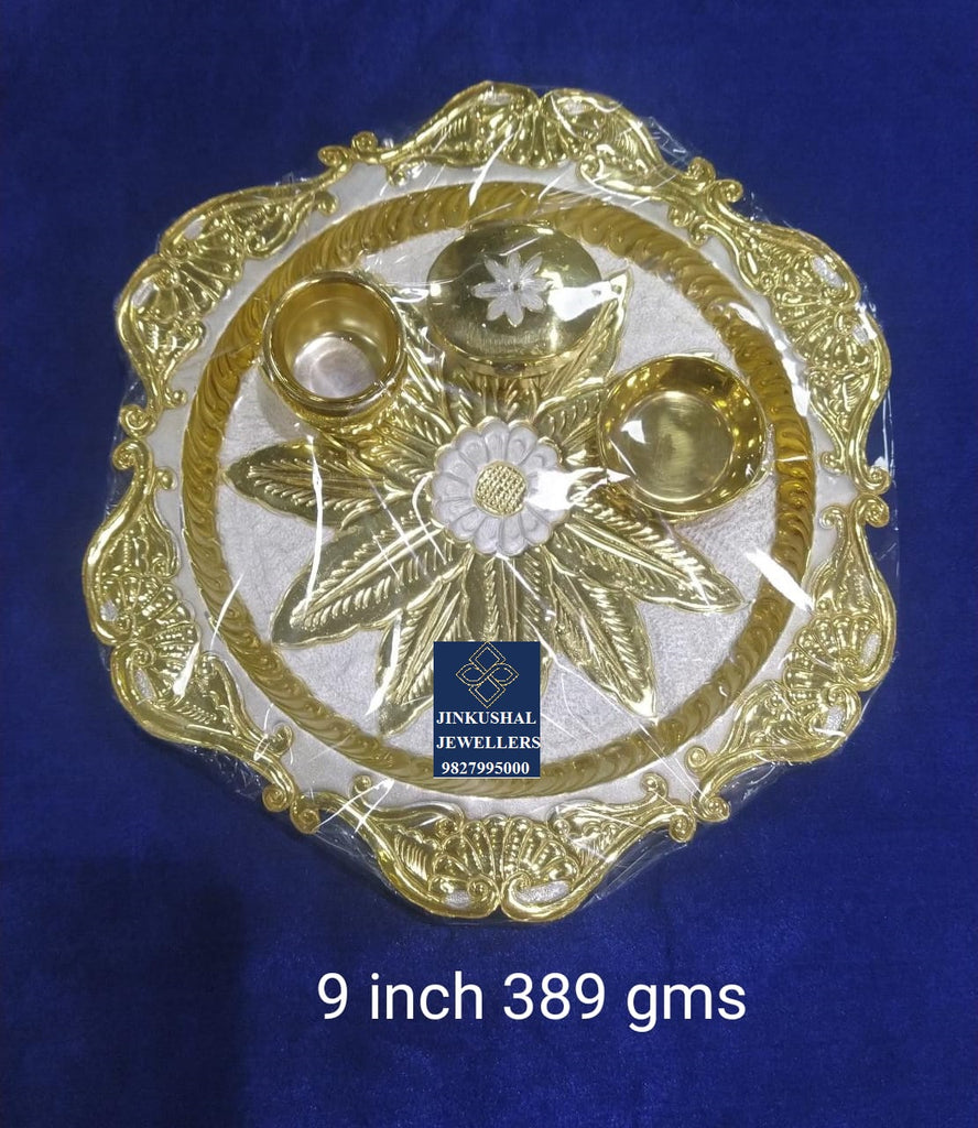 silver thali with gold polish