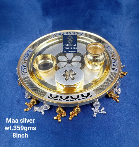 silver thali with gold polish